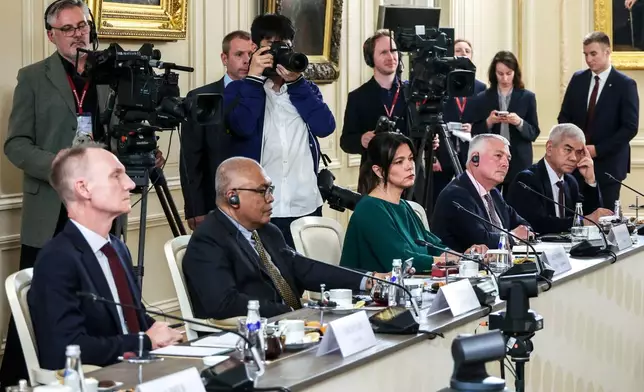 From left, The Associated Press News Director of Europe/Africa James Jordan, ANTARA News Director Akhmad Munir, BELTA Director General Iryna Akulovich, DPA Head of News Service Martin Romanczyk and Uzbekistan National News Agency Director General Abdusaid Kuchimov attend a meeting of Russian President Vladimir Putin with the heads of international news agencies at the newly renovated St. Petersburg Rimsky-Korsakov State Conservatory on the sidelines of the St. Petersburg International Economic Forum in St. Petersburg, Russia, Thursday, June 19, 2025. (Alexander Demyanchuk, Sputnik, Kremlin Pool Photo via AP)