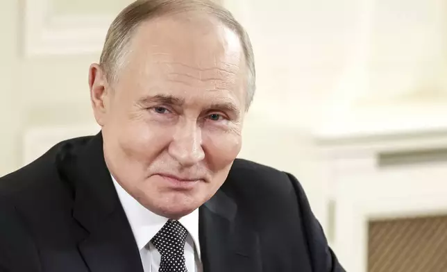 Russian President Vladimir Putin meets with the heads of international news agencies at the newly renovated St. Petersburg Rimsky-Korsakov State Conservatory on the sidelines of the St. Petersburg International Economic Forum in St. Petersburg, Russia, early Thursday, June 19, 2025. (Vyacheslav Prokofyev, Sputnik, Kremlin Pool Photo via AP)