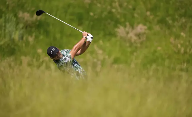 Patrick Reed tees off on the seventh hole during the first round of the U.S. Open golf tournament at Oakmont Country Club Thursday, June 12, 2025, in Oakmont, Pa. (AP Photo/Charlie Riedel)