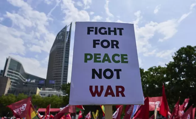 People attend a demonstration ahead of the NATO summit in The Hague, Netherlands, Sunday, June 22, 2025. (AP Photo/Peter Dejong)
