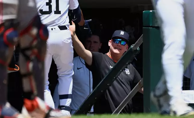 Detroit Tigers manager A.J. Hinch, right, congratulates Riley Greene (31) after Greene hit a home run during the fifth inning of a baseball game against the Minnesota Twins, Saturday, June 28, 2025, in Detroit. (AP Photo/Jose Juarez)