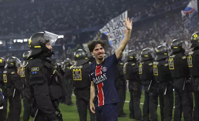 PSG's Vitinha celebrates after the Champions League final soccer match between Paris Saint-Germain and Inter Milan at the Allianz Arena in Munich, Germany, Saturday, May 31, 2025. (AP Photo/Alexandra Beier)