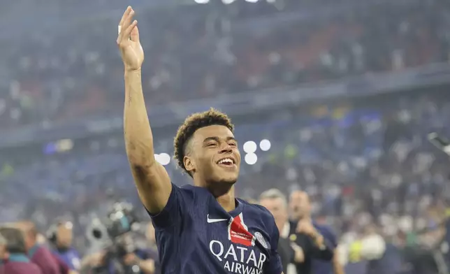 PSG's Desire Doue celebrates after the Champions League final soccer match between Paris Saint-Germain and Inter Milan at the Allianz Arena in Munich, Germany, Saturday, May 31, 2025. (AP Photo/Alexandra Beier)