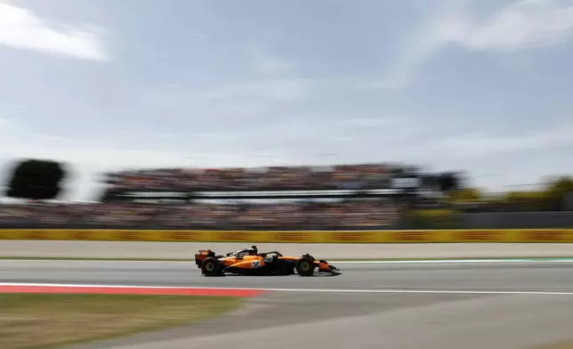 McLaren driver Oscar Piastri of Australia steers his car during the Spanish Grand Prix Formula One race at the Barcelona Catalunya racetrack in Montmelo, near Barcelona, Spain, Sunday, June 1, 2025. (AP Photo/Joan Monfort)