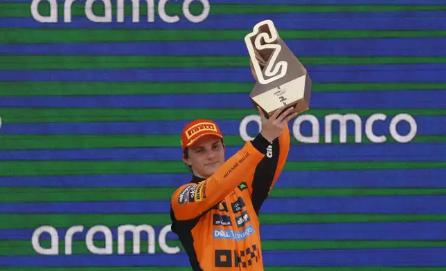 McLaren driver Oscar Piastri of Australia celebrates after winning the Spanish Grand Prix Formula One race at the Barcelona Catalunya racetrack in Montmelo, near Barcelona, Spain, Sunday, June 1, 2025. (AP Photo/Joan Monfort)