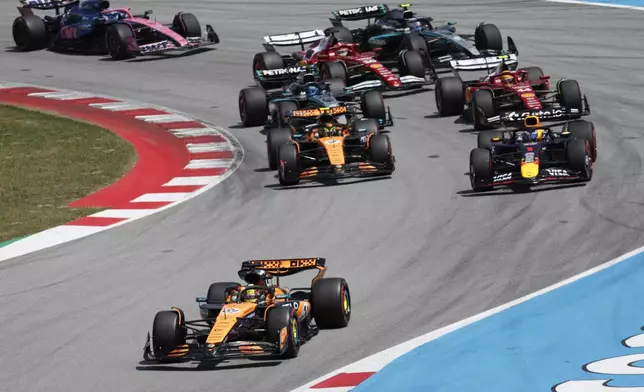 McLaren driver Oscar Piastri of Australia leads the field after the start the Spanish Grand Prix Formula One race at the Barcelona Catalunya racetrack in Montmelo, near Barcelona, Spain, Sunday, June 1, 2025. (AP Photo/Joan Monfort)