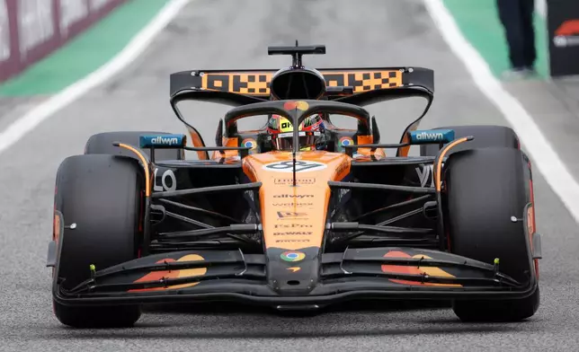 McLaren driver Oscar Piastri of Australia steers his car to parc ferme after the qualifying session ahead of the Spanish Grand Prix Formula One race at the Barcelona Catalunya racetrack in Montmelo, near Barcelona, Spain, Saturday, May 31, 2025. (AP Photo/Joan Monfort)