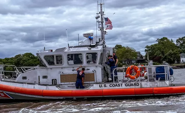 In this photo provided by the Branford Fire Department, Branford firefighters and the Coast Guard respond to a plane crash in the Long Island Sound, on Sunday, June 1, 2025, off the coast of Branford, Conn. (Branford Fire Department via AP)