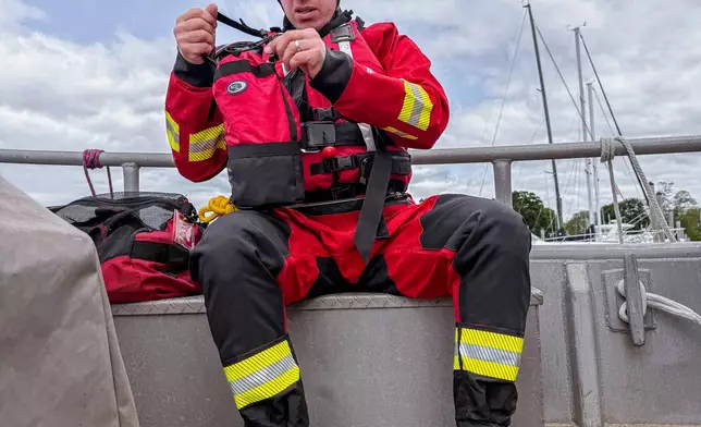 In this photo provided by the Branford Fire Department, Branford firefighters and the Coast Guard respond to a plane crash in the Long Island Sound, on Sunday, June 1, 2025, off the coast of Branford, Conn. (Branford Fire Department via AP)