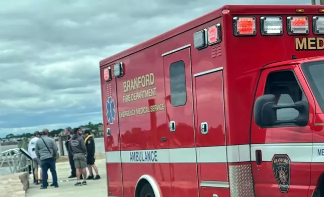 In this photo provided by the Branford Fire Department, Branford firefighters and the Coast Guard respond to a plane crash in the Long Island Sound, on Sunday, June 1, 2025, off the coast of Branford, Conn. (Branford Fire Department via AP)