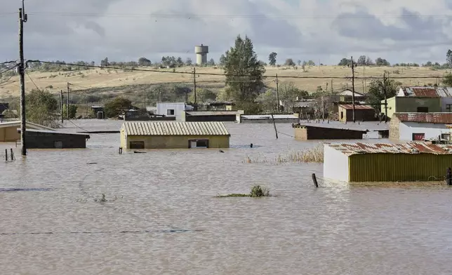 A view of homes submerged in floodwater, in Mthatha, South Africa, Tuesday, June 10, 2025. (AP Photo/Hoseya Jubase)