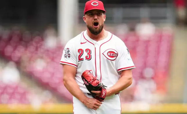 Cincinnati Reds pitcher Graham Ashcraft reacts as he walks to the dugout during the eighth inning of a baseball game against the Arizona Diamondbacks that was suspended Friday because of rain and resumed, Saturday, June 7, 2025, in Cincinnati. (AP Photo/Jeff Dean)