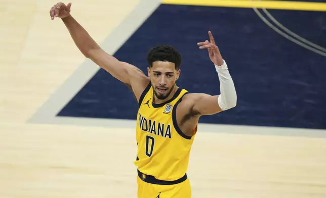 Indiana Pacers guard Tyrese Haliburton celebrates after a teammate made a 3-pointer during the second half of Game 6 of the Eastern Conference finals of the NBA basketball playoffs against the New York Knicks in Indianapolis, Saturday, May 31, 2025. (AP Photo/AJ Mast)