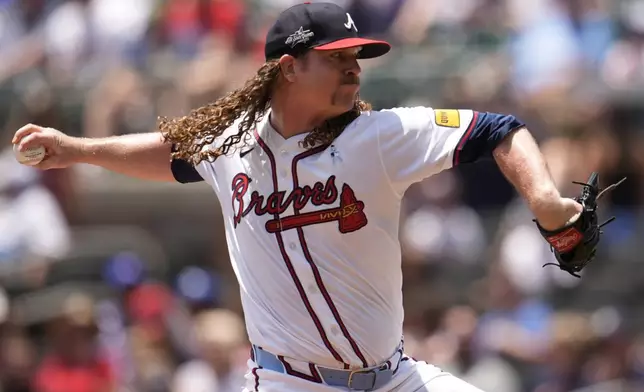 Atlanta Braves pitcher Grant Holmes (66) delivers against the Colorado Rockies in the second inning of a baseball game, Sunday, June 15, 2025, in Atlanta. (AP Photo/Mike Stewart)
