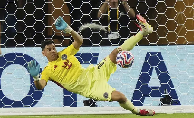 Inter Miami's goalkeeper Oscar Ustari saves a penalty during the Club World Cup group A soccer match between Al Ahly and Inter Miami in Miami, Fla., Saturday, June 14, 2025. (AP Photo/Lynne Sladky)