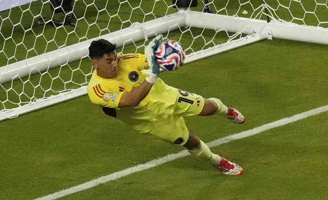 Inter Miami's Oscar Ustari saves a penalty from Al Ahly's Trezeguet during the Club World Cup group A soccer match between Al Ahly and Inter Miami in Miami, Fla., Saturday, June 14, 2025. (AP Photo/John Raoux)