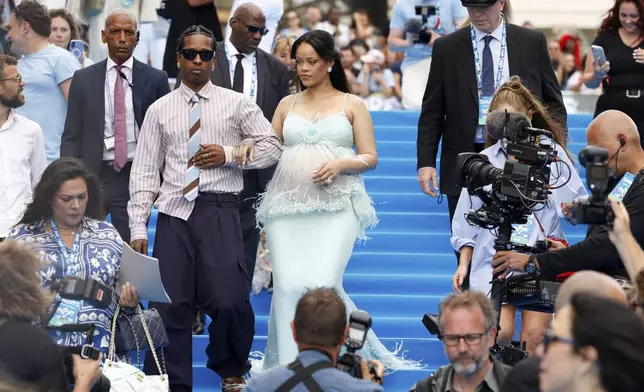 A$AP Rocky, left, and Rihanna arrive at the world premiere of the film "Smurfs", on Saturday, June 28, 2025, in Brussels. (AP Photo/Omar Havana).