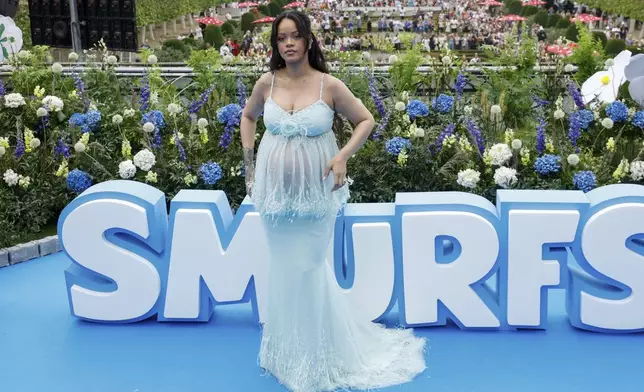 Rihanna poses for photographers upon arrival at the world premiere of the film "Smurfs", on Saturday, June 28, 2025, in Brussels. (AP Photo/Omar Havana).
