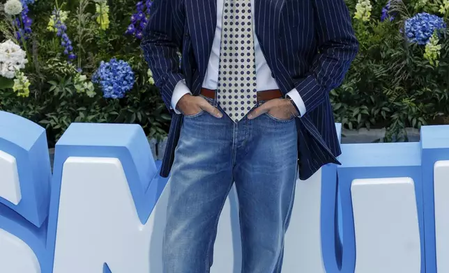 Dan Levy poses for photographers upon arrival at the world premiere of the film "Smurfs", on Saturday, June 28, 2025, in Brussels. (AP Photo/Omar Havana).