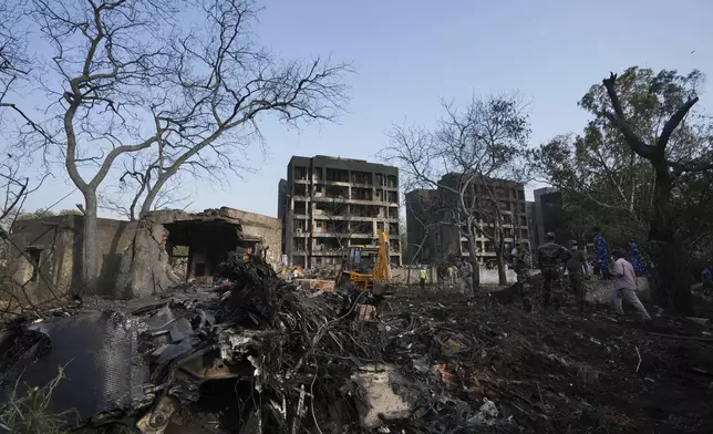 Rescuers work at the site of an airplane that crashed in India's northwestern city of Ahmedabad in Gujarat state, Thursday, June 12, 2025. (AP Photo/Ajit Solanki)