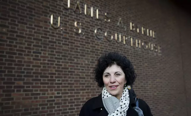 FILE - Eleanor Perfetto widow of NFL player Ralph Wenzel leaves the U.S. Courthouse after a hearing on the proposed NFL concussion settlement Wednesday, Nov. 19, 2014, in Philadelphia. (AP Photo/Matt Rourke, file)