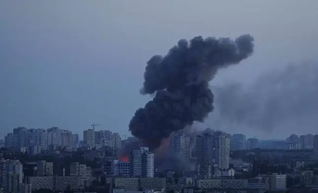 Smoke rises after a Russian air strike on Kyiv, Ukraine, on Friday, June 6, 2025. (AP Photo/Evgeniy Maloletka)
