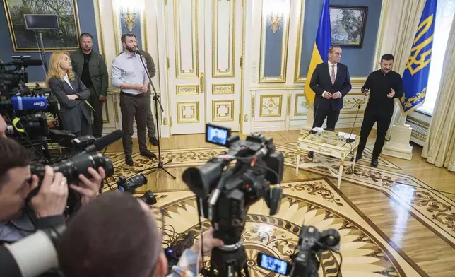 Ukrainian President Volodymyr Zelenskyy, right, and German Defence Minister Boris Pistorius attend a news conference during their meeting in Kyiv, Ukraine, on Thursday, June 12, 2025. (AP Photo/Evgeniy Maloletka)