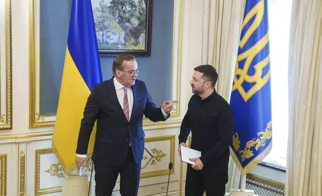 German Defence Minister Boris Pistorius, left, and Ukrainian President Volodymyr Zelenskyy attend a news conference during their meeting in Kyiv, Ukraine, on Thursday, June 12, 2025. (AP Photo/Evgeniy Maloletka)
