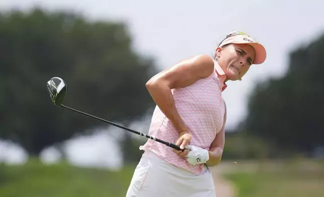Lexi Thompson watcher her tee shot on the sixth hole during the third round of the Women's PGA Championship golf tournament Saturday, June 21, 2025, in Frisco, Texas. (AP Photo/LM Otero)