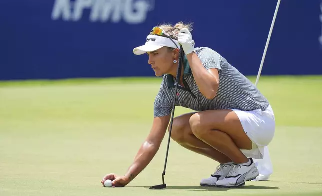 Lexi Thompson lines up a putt on the 18th hole during the second round of the Women's PGA Championship golf tournament Friday, June 20, 2025, in Frisco, Texas. (AP Photo/LM Otero)