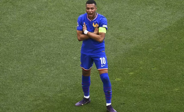 France's Kylian Mbappe celebrates after scoring the opening goal during the Nations League third place soccer match between Germany and France in Stuttgart, Germany, Sunday, June 8, 2025. (Marijan Murat/dpa via AP)