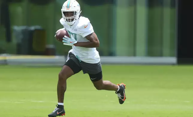 Miami Dolphins wide receiver Jaylen Waddle (17) runs drills during an NFL football practice, Wednesday, May 28, 2025, in Miami Gardens, Fla. (AP Photo/Marta Lavandier)