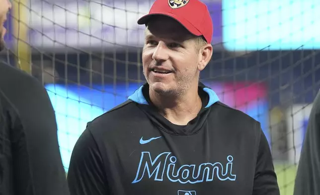 Miami Marlins manager Clayton McCullough wears a Florida Panthers cap before a baseball game against the San Francisco Giants, Friday, May 30, 2025, in Miami. (AP Photo/Lynne Sladky)