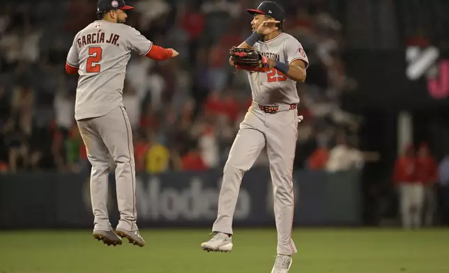 Washington Nationals second baseman Luis Garcia Jr. (2) celebrates with Nationals' left fielder James Wood after the final out of the ninth inning of a baseball game against the Los Angeles Angels, Friday, June 27, 2025, in Anaheim, Calif. (AP Photo/Jayne Kamin-Oncea)