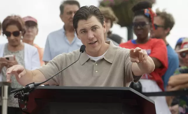 Washington Capitals forward T.J. Oshie speaks to the crowd at Washington Harbour to announce his retirement from the NHL, Monday, June 9, 2025, in Washington. (AP Photo/Rod Lamkey, Jr.)