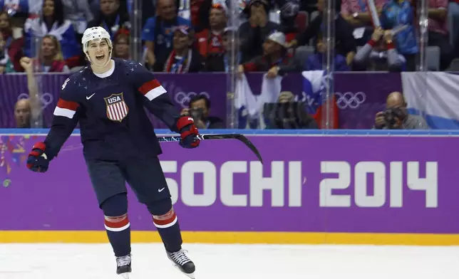 FILE - USA forward T.J. Oshie reacts after scoring the winning goal in a shootout against Russia during overtime of a men's ice hockey game at the 2014 Winter Olympics, Saturday, Feb. 15, 2014, in Sochi, Russia. (AP Photo/Mark Humphrey, File)