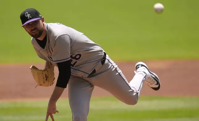 Colorado Rockies' Austin Gomber (26) delivers against Atlanta Braves' Ronald Acuña Jr., in the first inning of a baseball game, Sunday, June 15, 2025, in Atlanta. (AP Photo/Mike Stewart)