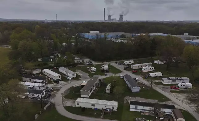 The Rockport Power Plant operates near a group of mobile homes Friday, April 11, 2025, in Rockport, Ind. (AP Photo/Joshua A. Bickel)