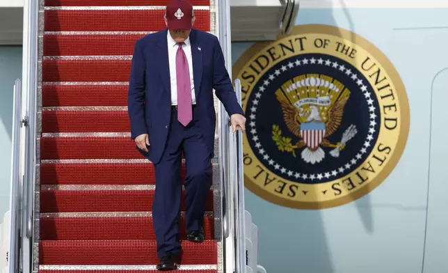 President Donald Trump walks down the stairs of Air Force One upon his arrival at Joint Base Andrews, Md., Tuesday, June 10, 2025. (AP Photo/Luis M. Alvarez)