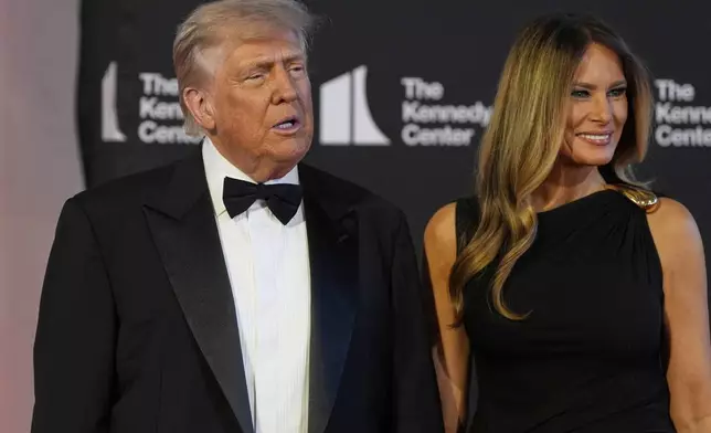 President Donald Trump and first lady Melania Trump arrive to view opening night of "Les Miserables," at the Kennedy Center, Wednesday, June 11, 2025, in Washington. (AP Photo/Alex Brandon)