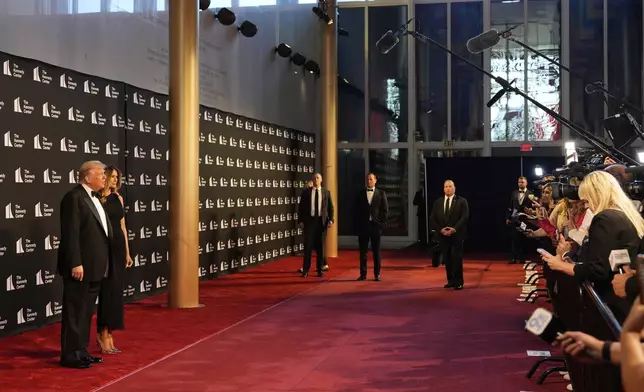 President Donald Trump and first lady Melania Trump arrive to view opening night of "Les Miserables," at the Kennedy Center, Wednesday, June 11, 2025, in Washington. (AP Photo/Alex Brandon)
