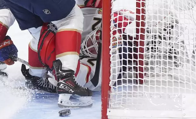 Florida Panthers goalie Sergei Bobrovsky stops Edmonton Oilers' Connor McDavid, not seen, during the second period in Game 2 of the NHL hockey Stanley Cup Finals, in Edmonton, Alberta, Friday, June 6, 2025. (Darryl Dyck/The Canadian Press via AP)