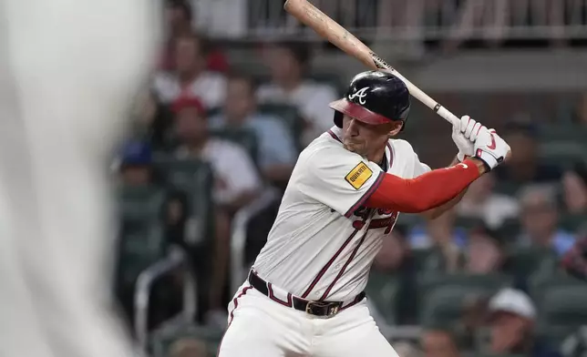 Atlanta Braves' Matt Olson (28) hits a single RBI in the third inning of a baseball game against the New York Mets, Tuesday, June 17, 2025, in Atlanta. (AP Photo/Brynn Anderson)