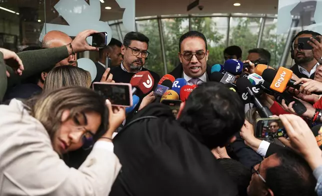 Lawyer Victor Mosquera, representative of Senator Miguel Uribe Turbay, talks outside the clinic where the Colombian Senator is being treated after he was shot at a political rally in Bogota, Colombia, Monday, June 9, 2025. (AP Photo/Ivan Valencia)