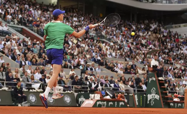 Italy's Jannik Sinner plays a shot against Serbia's Novak Djokovic during their semifinal match of the French Tennis Open at the Roland-Garros stadium in Paris, Friday, June 6, 2025. (AP Photo/Lindsey Wasson)