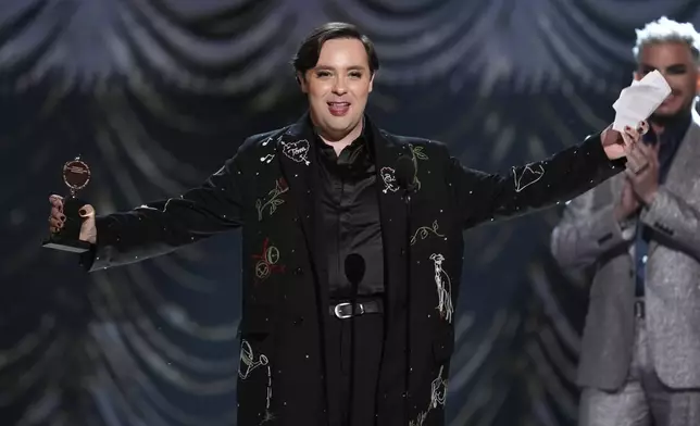 Jak Malone accepts the award for best performance by an actor in a featured role in a musical for "Operation Mincemeat: A New Musical" during the 78th Tony Awards on Sunday, June 8, 2025, at Radio City Music Hall in New York. (Photo by Charles Sykes/Invision/AP)
