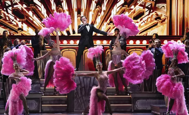 Jonathan Groff, center, performs a medley from "Just in Time" during the 78th Tony Awards on Sunday, June 8, 2025, at Radio City Music Hall in New York. (Photo by Charles Sykes/Invision/AP)