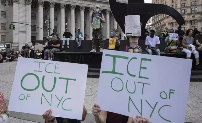 Demonstrators hold signs and chant during a protest against deportation by Immigration and Customs Enforcement in New York, Wednesday, June 11, 2025. (AP Photo/Yuki Iwamura)