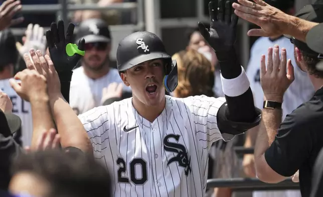Chicago White Sox's Miguel Vargas celebrates with teammates after hitting a two-run home run during the first inning of a baseball game against the Kansas City Royals in Chicago, Sunday, June 8, 2025. (AP Photo/Nam Y. Huh)