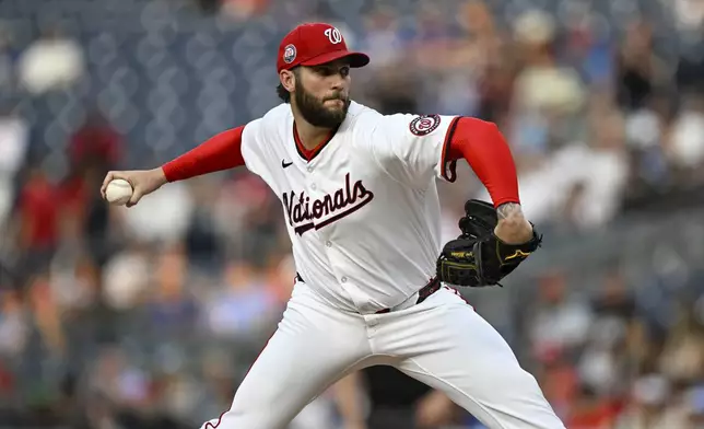 Washington Nationals pitcher Trevor Williams (32) throws during the third inning of a baseball game against the Chicago Cubs in Washington, Tuesday, June 3, 2025. (AP Photo/Terrance Williams)